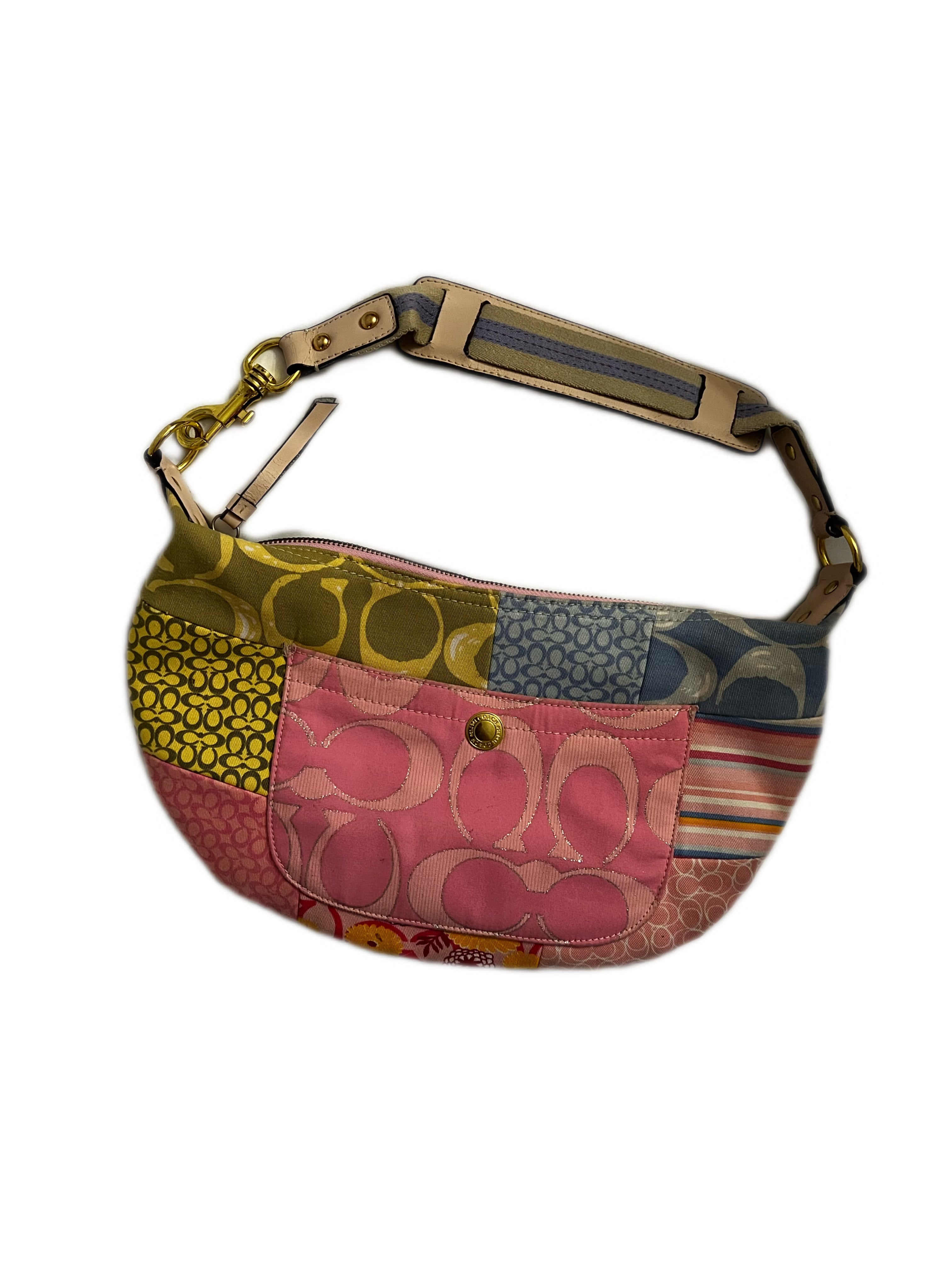 Multicolored patterned handbag with a brown strap on a white background