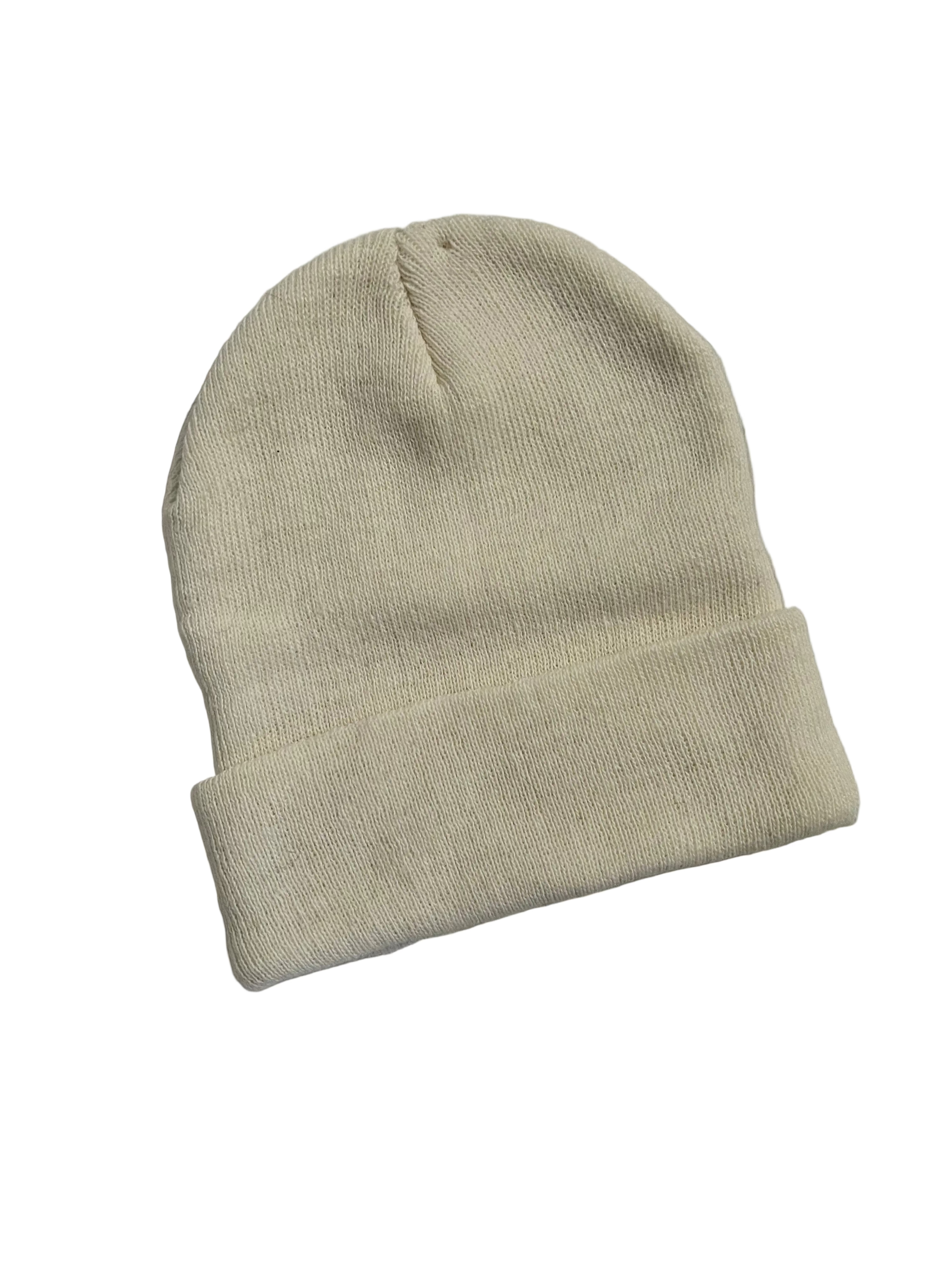 Beige knit beanie on a light gray background